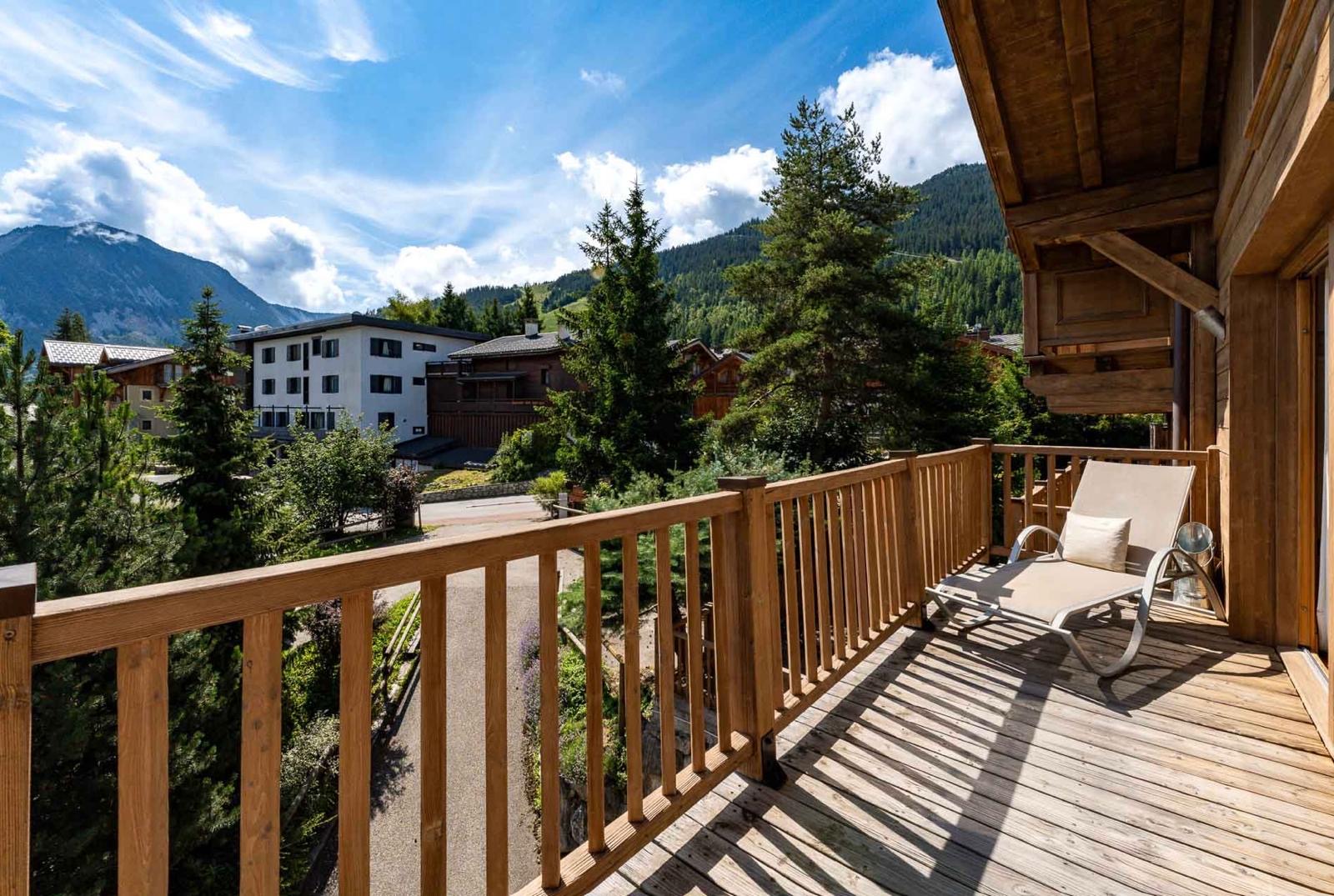 Balcony of an alpine property looking out to the mountains